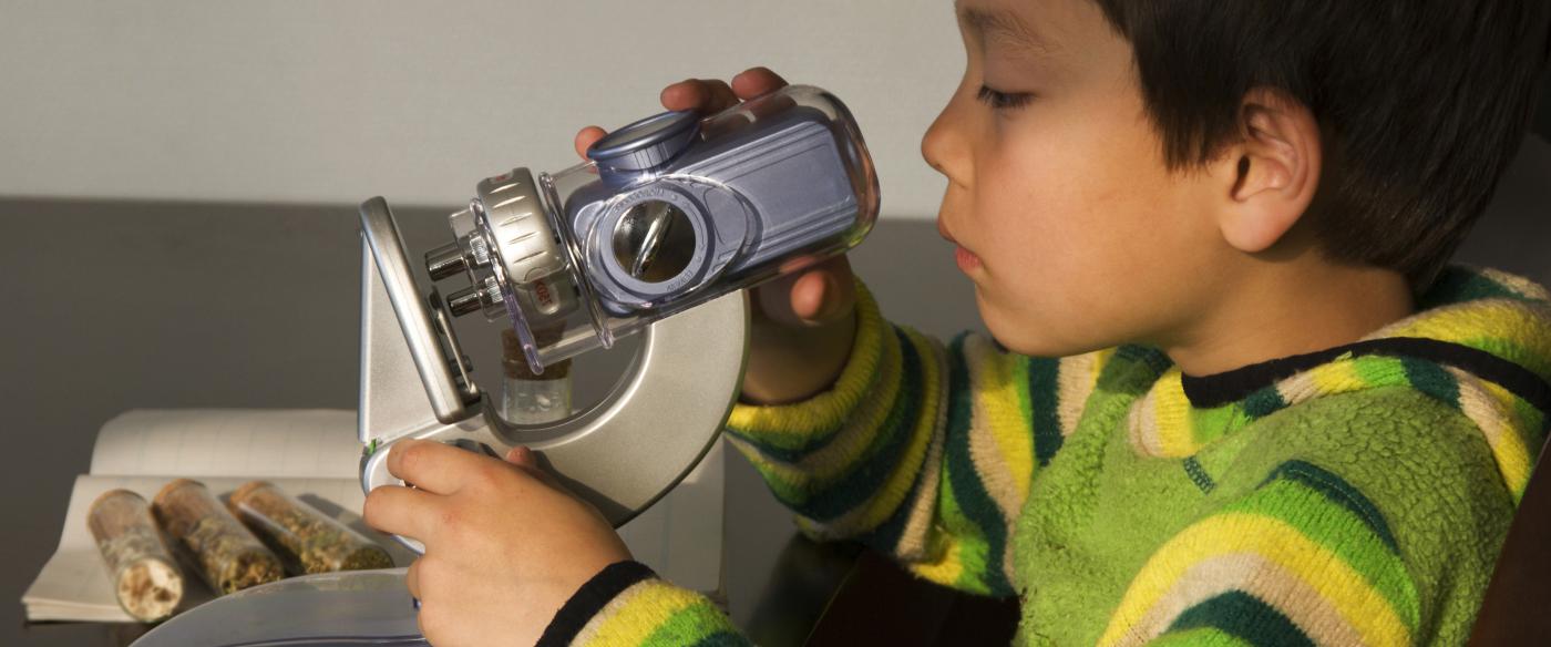 boy with microscope